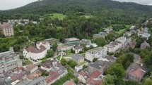 Establishing shot of resort town Baden-Baden, Germany. Downward view of Caracalla Spa. Aerial orbit