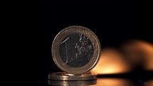 Euro coins on fire. Filmed is slow motion 1000 fps. 