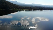 Drone footage over mountain lake
