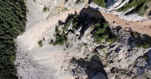 Top View Of The Limestone Landscape And Rocky Formation At Hasmas Mountains In Romania. ascending drone shot