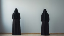 View of two nuns from the back