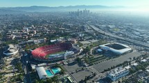 Cinematic view of the LA Coliseum, the surrounding stadiums, and Downtown Los Angeles.