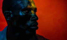 AI Generated Image. Serious African man on a red background