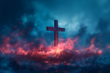 Wooden cross in field with fire and clouds on dark blue sky