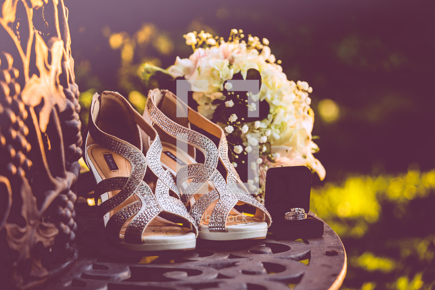 silver high heels and wedding bands 