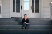  boy sitting on stairs