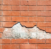 concrete hole in a brick wall 