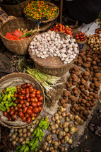 vegetables, nuts, and spices in a market in Haiti