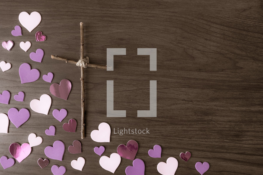 pink paper hearts and cross of sticks 