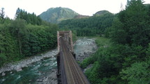 a train bridge over a river 