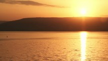 Closeup of sunrise over the Sea of Galilee.
