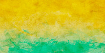 lively golden yellow and green painted background on textured paper