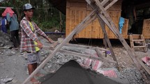 Asian Men Making Concrete Sifting Sand