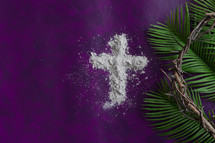 palm fronds, crown of thorns, and ashes on purple 
