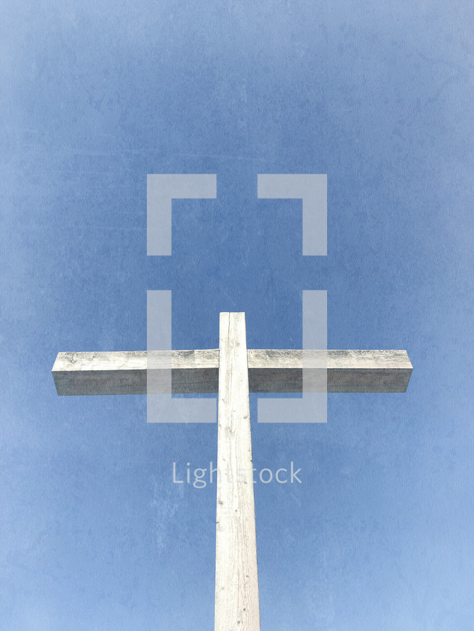 vertical wood cross with light blue sky and distressed texture