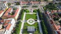 Aerial shot drone lowers as camera pans up over Park Josipa Jurja Strossmayera in Zagreb, Croatia