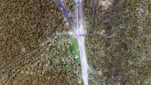 Aerial shot drone flying forward with camera pointing straight down over hiking trail