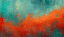 sweeping orange painted across turquoise blue green background abstract paint effect on canvas
