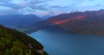 Interlaken Switzerland Aerial Drone Shot Alps Rugged Mountians Sunset Push In Swiss Countryside Outback Landscape