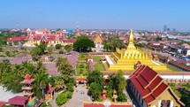 Aerial Vientiane Laos Capitol Temple Palace Flying View Drone Footage Pha That Luang 4K