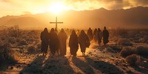 People walking towards a cross in the desert at sunset