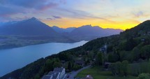 Interlaken Switzerland Town Aerial Drone Shot Mountians Sunset Push In Swiss Countryside Landscape Alps Rugged
