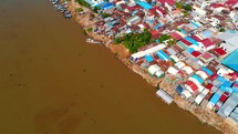 Aerial Phnom Penh Mekong River Comunity Pan Up To City 