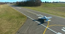 Aerial Footage Airport Plane Taxiing On Runway Small Airplane