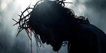 Jesus with crown of thorns, blood drips from crown, copy space