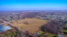 Lansing Michigan Aerial Establishing Shot From Farmers Fields To City Urban Neighborhood Drone Backcountry Country Primitive Flying