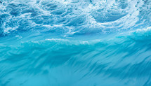 ocean surface in turquoise blue with white foam