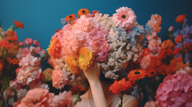 AI generated image. Anonymous person hiding behind the colorful fresh flowers on a blue background
