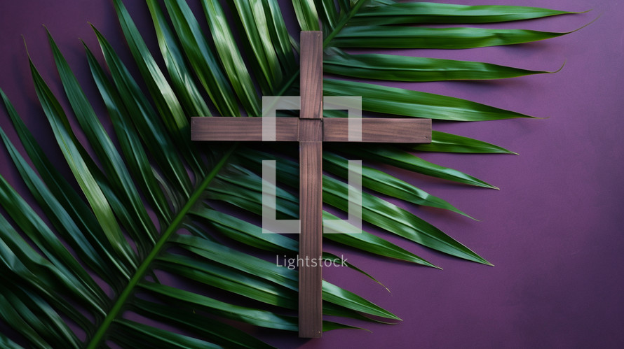 Lent flat lay with purple background, cross, and palm leaf