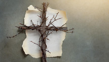 rustic cross with thorny vines, off-center layout with torn edge paper