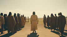 Jesus splitting a crowd of followers.
