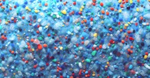 4k animated background moving slowly horizontally for infinite loop - Plastic pollution, Microplastics.