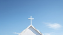 White simple church steeple with blue sky