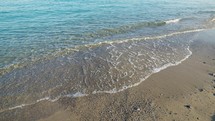Beach with Sea and Calm Waves in Summer in Sicily