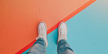 white shoes standing on a bright colored background with copy space