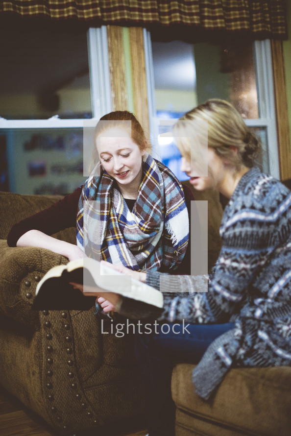 two women reading a Bible 