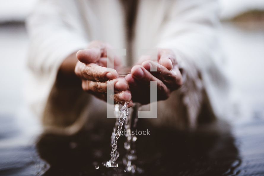 water in cupped hands of Jesus 
