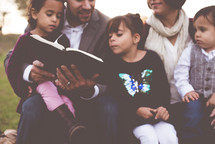 a family reading the Bible together 