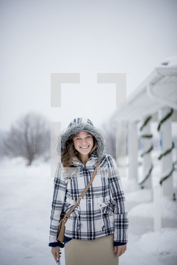 smiling woman in a winter coat 