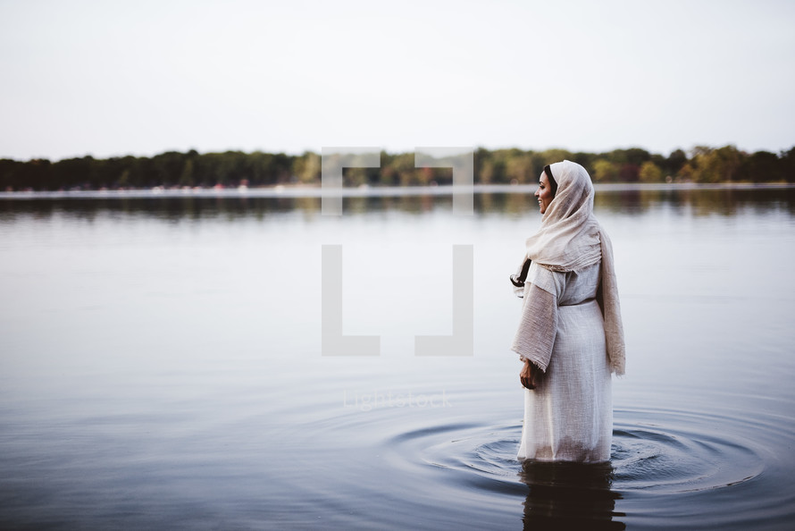 woman in biblical times standing in water 