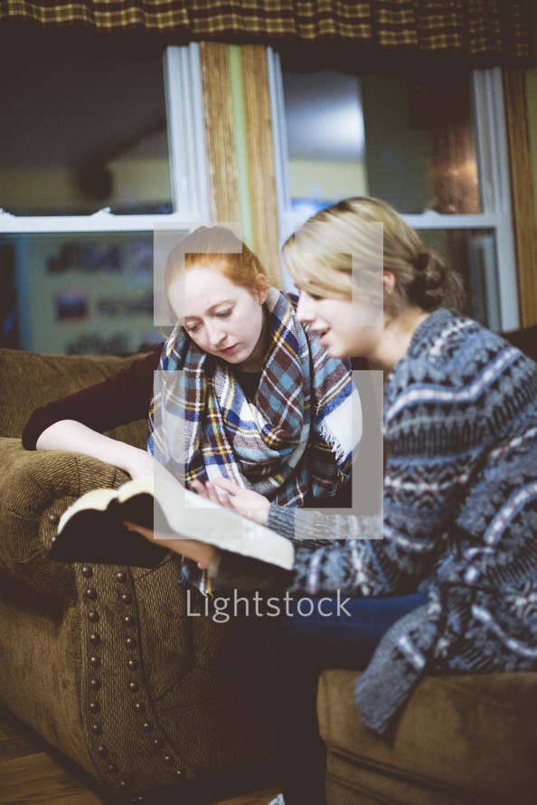 two women reading Bibles 