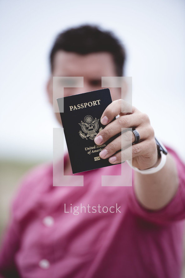man holding a passport 