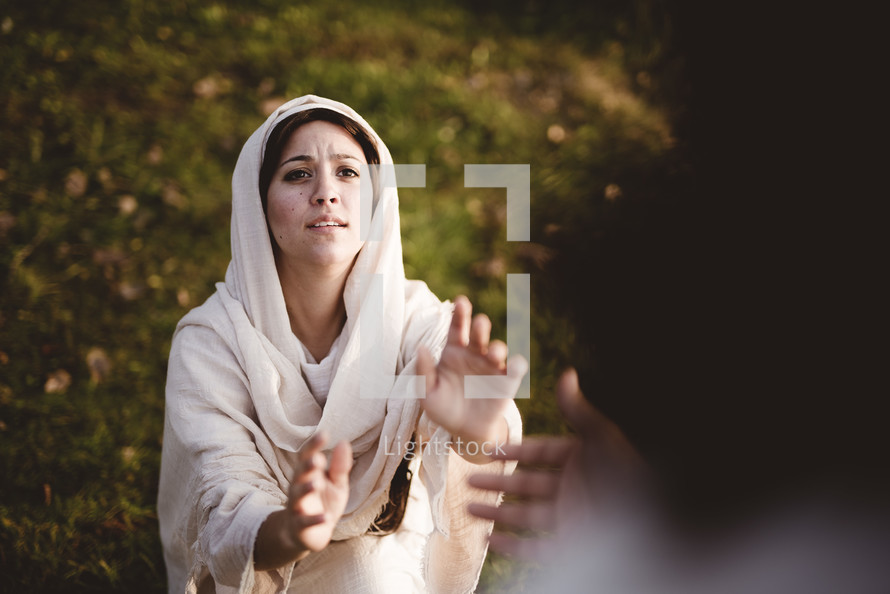Jesus reaching towards a woman 