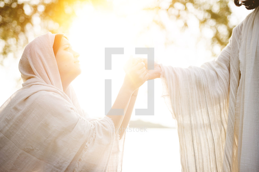 woman taking Jesus's hand 