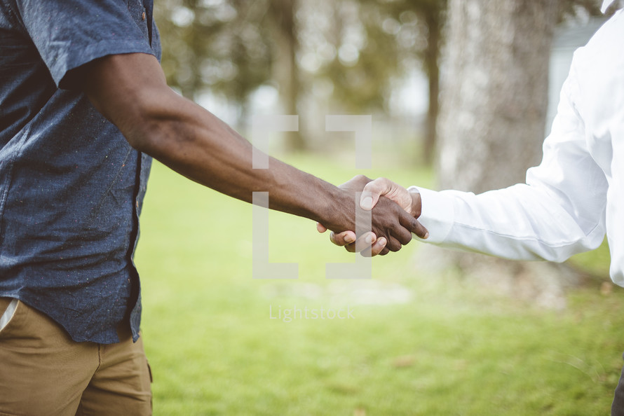 two men shaking hands 