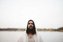 Jesus standing in front of a sea 